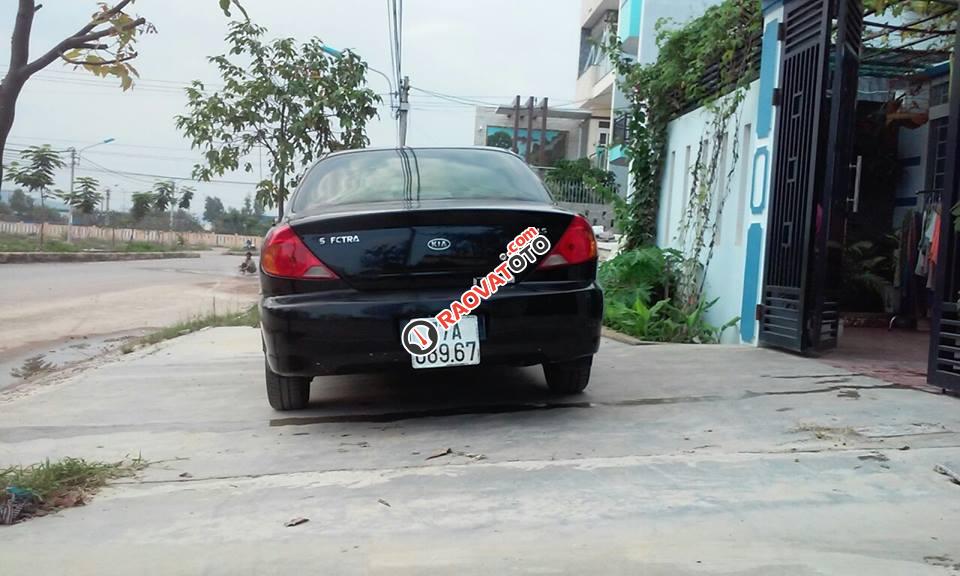 Bán xe Kia Spectra đời 2004, màu đen-0