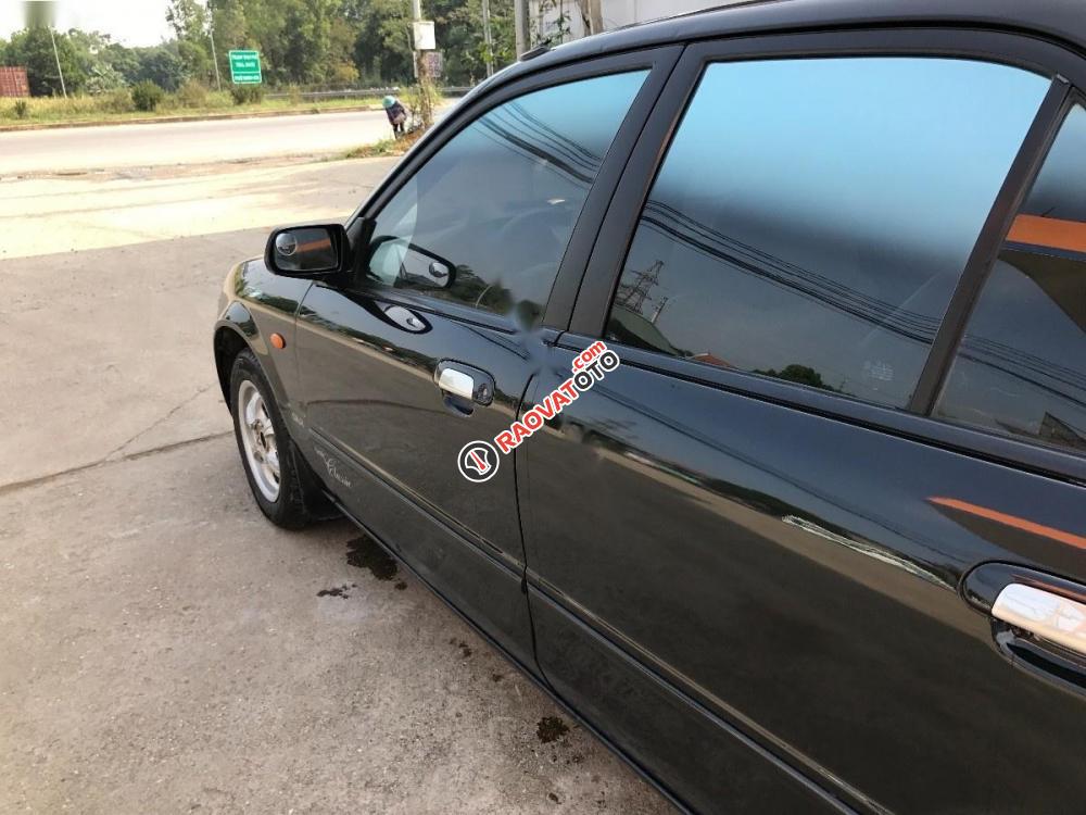 Bán Mazda 323 đời 2004, màu đen, xe nhập, giá tốt-3