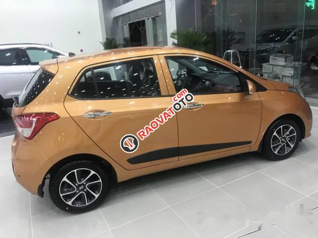 Bán xe Hyundai Grand i10 đời 2017, màu vàng cam-0