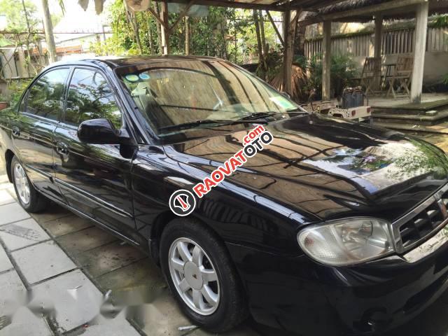 Cần bán xe Kia Spectra đời 2004, màu đen, chính chủ giá cạnh tranh-1