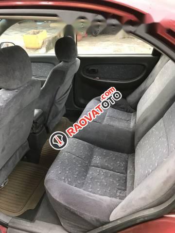 Cần bán xe Kia Spectra sản xuất 2003, màu đỏ chính chủ-0