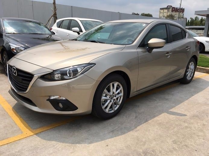 Bán xe Mazda 3 1.5L AT đời 2017, màu vàng, xe nhập -1