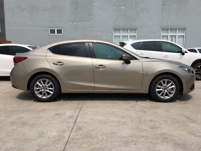 Bán xe Mazda 3 1.5L AT đời 2017, màu vàng, xe nhập -4