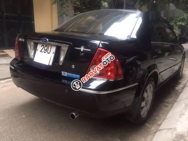 Cần bán lại xe Ford Laser Ghia 1.8 sản xuất 2004, màu đen số tự động-0