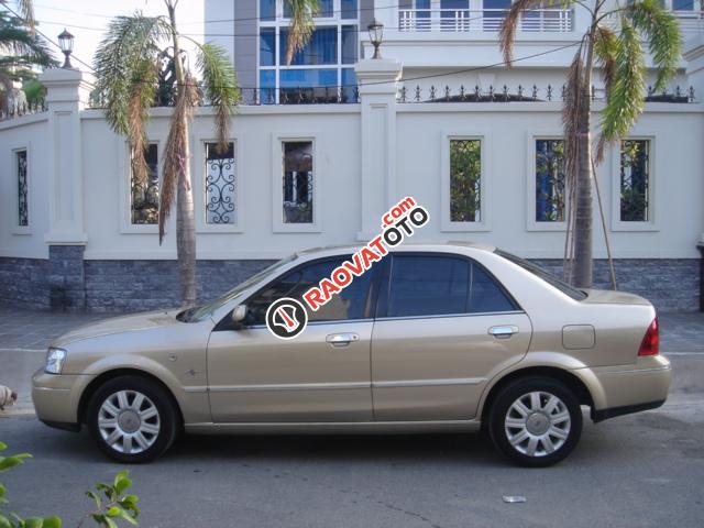 Nhà cần bán Ford laser 2005 AT 1.8 sunrup mui, màu vàng, xe rất mới-4