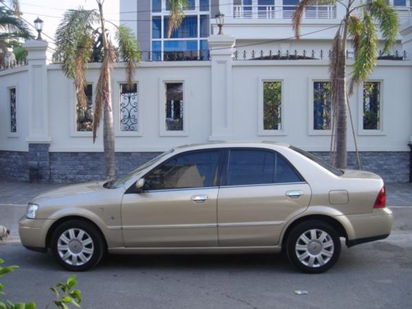 Cần bán gấp Ford Laser 1.8AT năm 2005, màu vàng-1