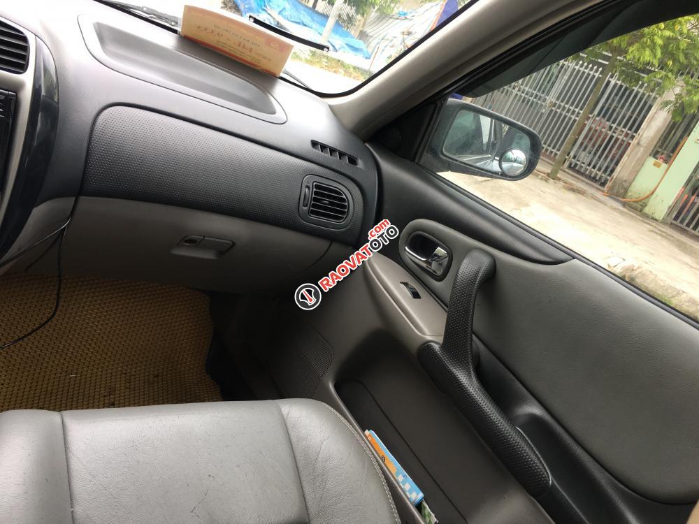 Bán Ford Laser Ghia 1.8MT đời 2003, màu bạc-0