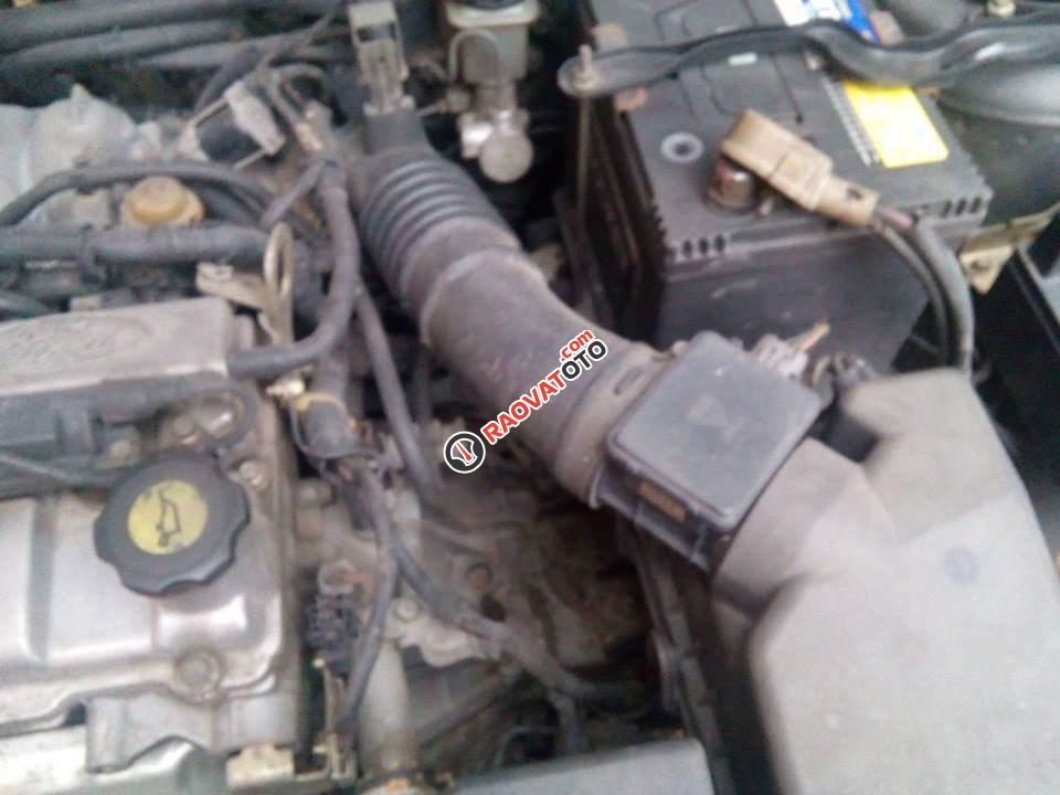 Bán Ford Laser GHIA 2004, màu đen chính chủ, giá 242tr-6