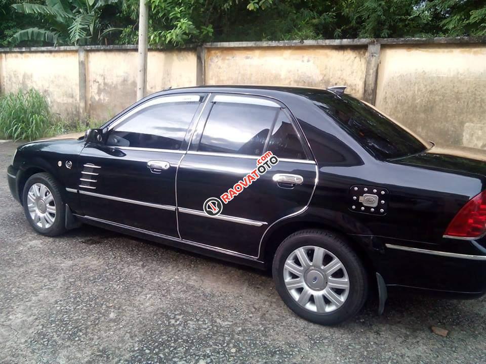 Bán Ford Laser GHIA 2004, màu đen chính chủ, giá 242tr-2