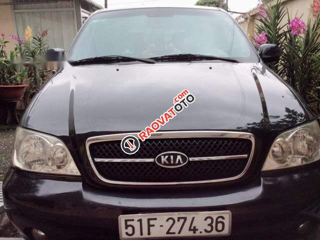 Cần bán xe Kia Carnival GS năm 2009, màu đen số tự động, giá 325tr-0