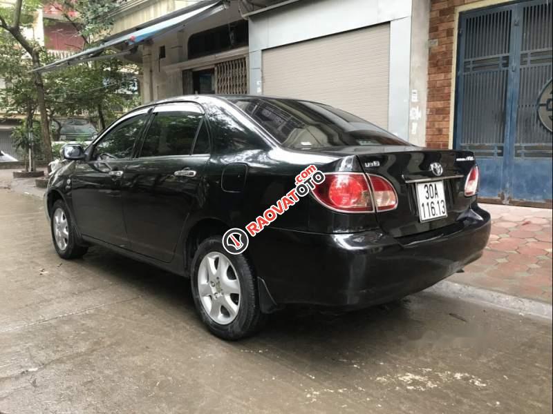 Cần bán gấp Toyota Corolla altis 1.8MT đời 2009, màu đen, xe gia đình -1