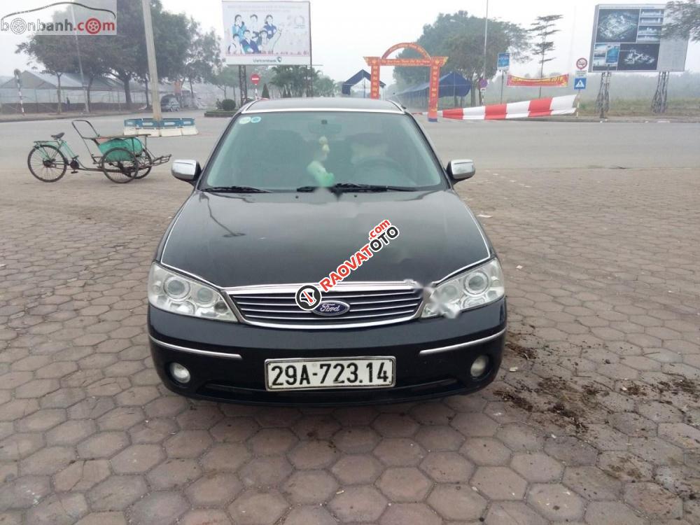 Bán Ford Laser Ghia 2004, màu đen như mới, giá tốt-1