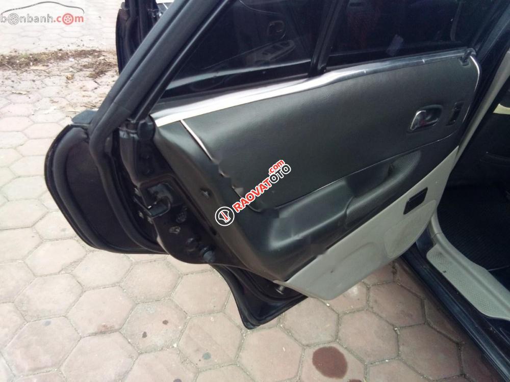 Bán Ford Laser Ghia 2004, màu đen như mới, giá tốt-6