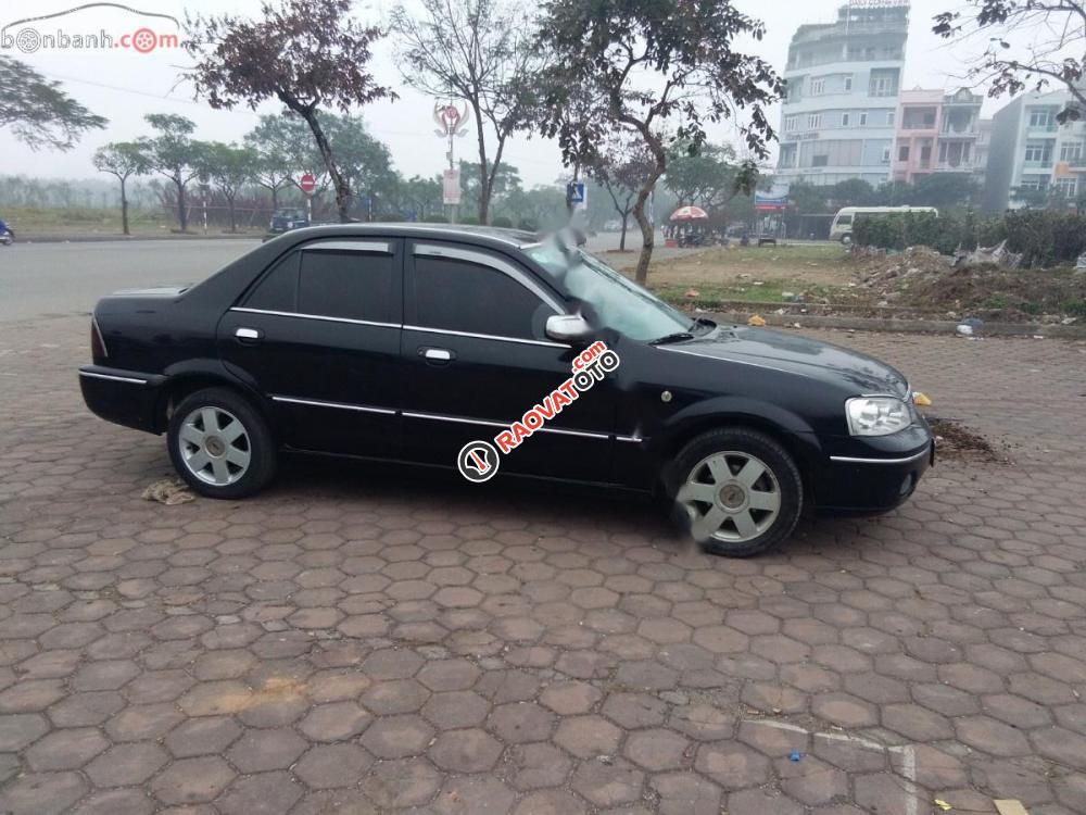 Bán Ford Laser Ghia 2004, màu đen như mới, giá tốt-2