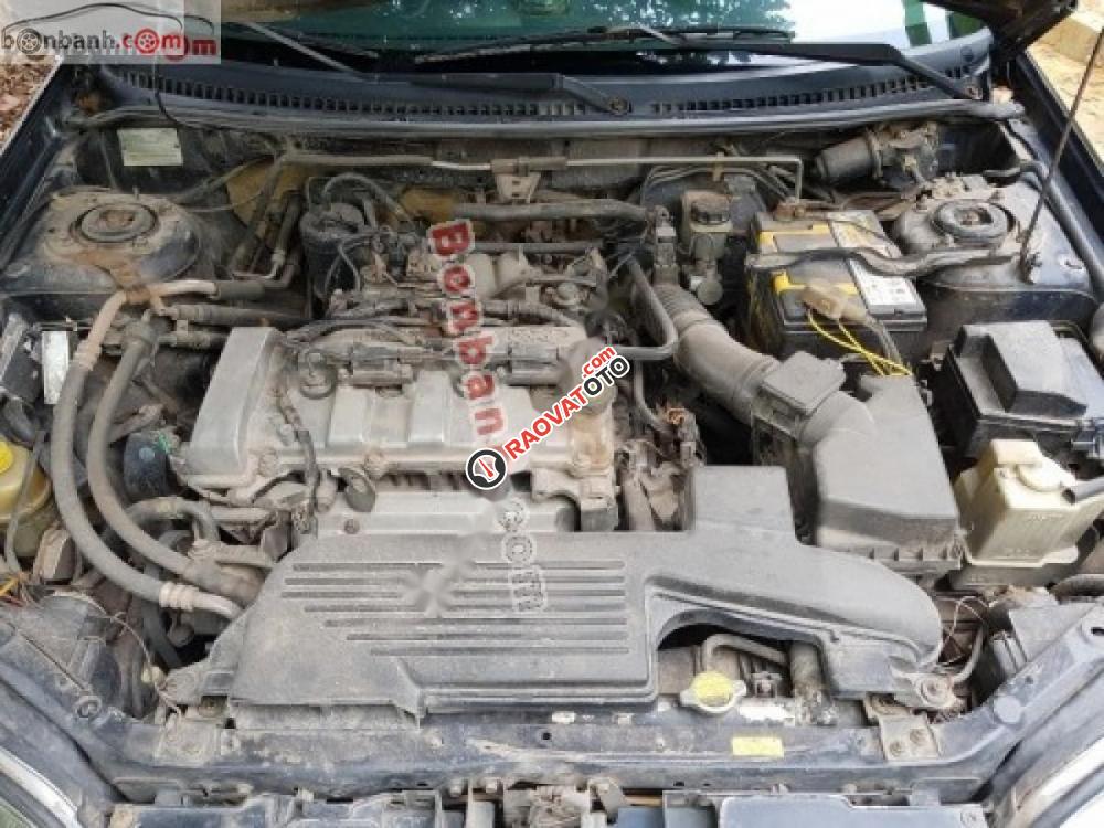 Bán Ford Laser 1.8 sản xuất năm 2003, màu đen, gầm bệ chắc chắn, điều hòa lạnh sâu-1