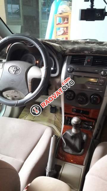 Gia đình bán Toyota Corolla Altis 1.8 G, màu bạc, số sàn-1
