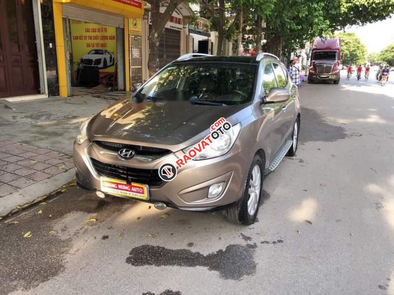 Bán xe Hyundai Tucson 2.0AT 2010, màu vàng, nhập khẩu  -0