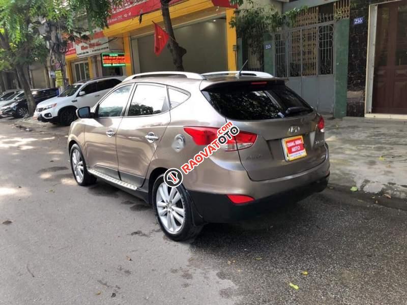 Bán xe Hyundai Tucson 2.0AT 2010, màu vàng, nhập khẩu  -1