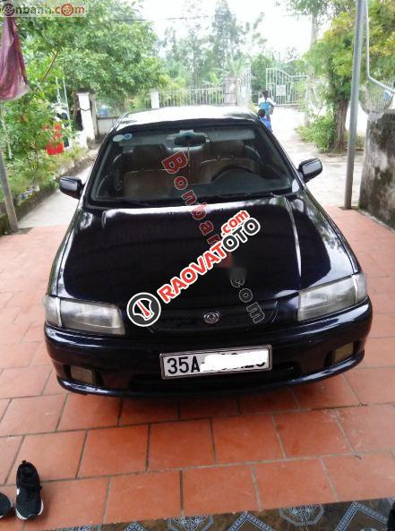 Cần bán xe Mazda 323 năm 2000, màu đen chính chủ, giá 70tr-0