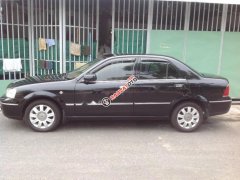 Bán Ford Laser Ghia 1.8 năm 2004, màu đen số sàn