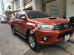 Bán xe Toyota Hilux 2.5E sản xuất năm 2016, màu cam, giá tốt