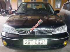 Chính chủ cần bán xe Ford Laser GHIA 1.8 sản xuất năm 2003, màu đen, giá cạnh tranh