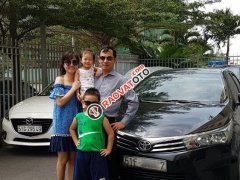 Bán xe Toyota Corolla altis 1.8MT đời 2015, màu đen số sàn, 580 triệu