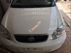 Bán Toyota Corolla altis 1.3 đời 2003, màu trắng, xe nhập xe gia đình