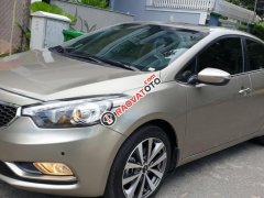 Bán Kia K3 1.6 AT số tự động model 2014, Sx 2013, màu vàng 1 đời chủ mới 90%