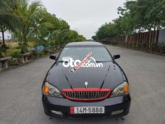 Cần bán xe Daewoo Magnus AT sản xuất năm 2004, màu đen số tự động, giá chỉ 125 triệu