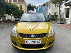 Bán Suzuki Swift 1.4AT năm 2017, màu vàng, giá tốt