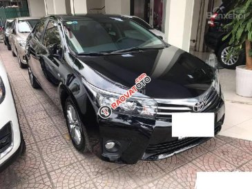 Cần bán Toyota Corolla altis 1.8 đời 2015, màu đen 