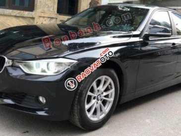 Cần bán xe BMW 320i sản xuất 2012, model 2013 màu đen