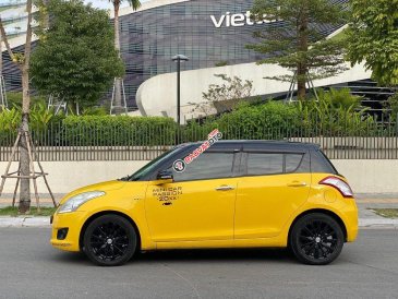 Bán Suzuki Swift 1.4 AT đời 2014, màu vàng, giá 345tr