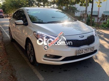 Cần bán lại xe Kia K3 2.0AT năm 2015, màu trắng