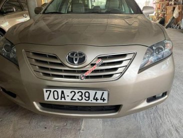 Bán xe Toyota Camry LE năm 2006, màu vàng, nhập khẩu nguyên chiếc