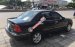 Bán ô tô Ford Laser Ghia 1.8 đời 2003, màu đen 