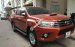 Bán xe Toyota Hilux 2.5E sản xuất năm 2016, màu cam, giá tốt