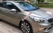 Bán Kia K3 1.6 AT số tự động model 2014, Sx 2013, màu vàng 1 đời chủ mới 90%