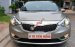 Bán Kia K3 1.6 AT số tự động model 2014, Sx 2013, màu vàng 1 đời chủ mới 90%